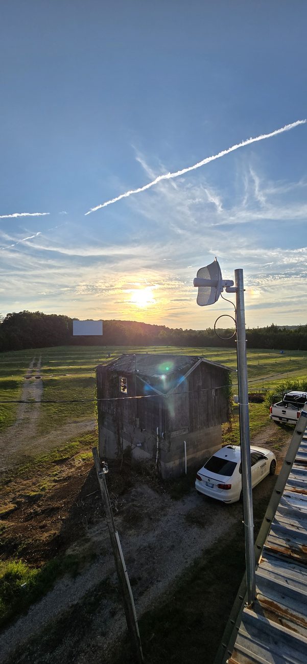 TownLink wireless radio mounted above a rural service area at sunset